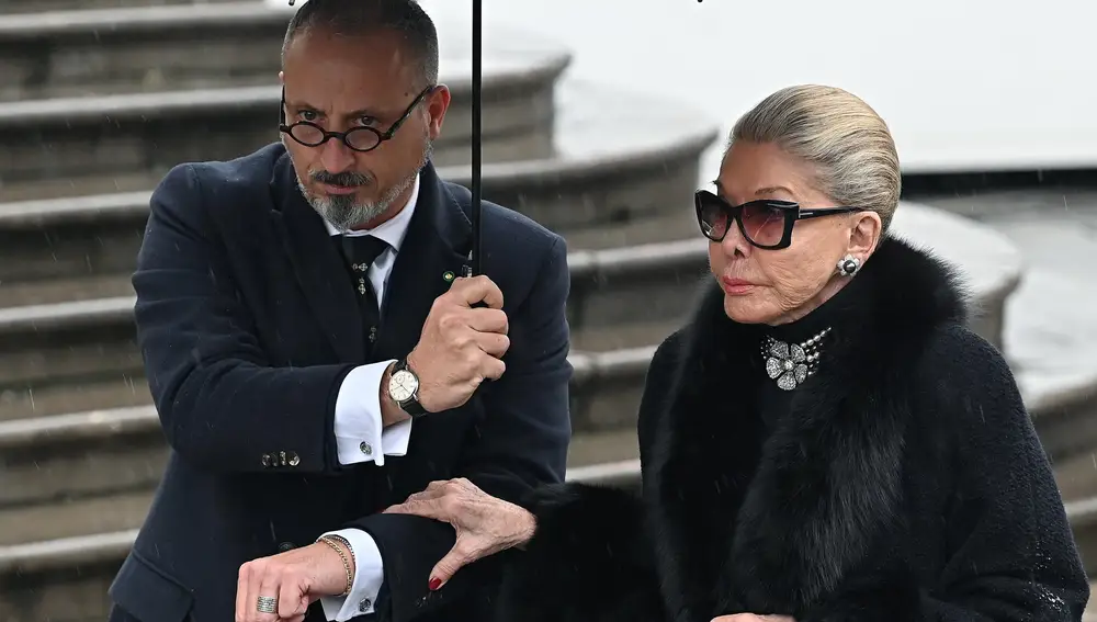 Marina Doria of Savoy (R), the widow of Prince Vittorio Emanuele of Savoy, arrives for the funeral ceremony of her late husband at the Duomo cathedral in Turin, northern Italy, 10 February 2024. 