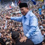 Presidential candidate and Indonesia’s Defence Minister Prabowo Subianto (C) reacts during a campaign rally at the Gelora Bung Karno Stadium in Jakarta on February 10, 2024.