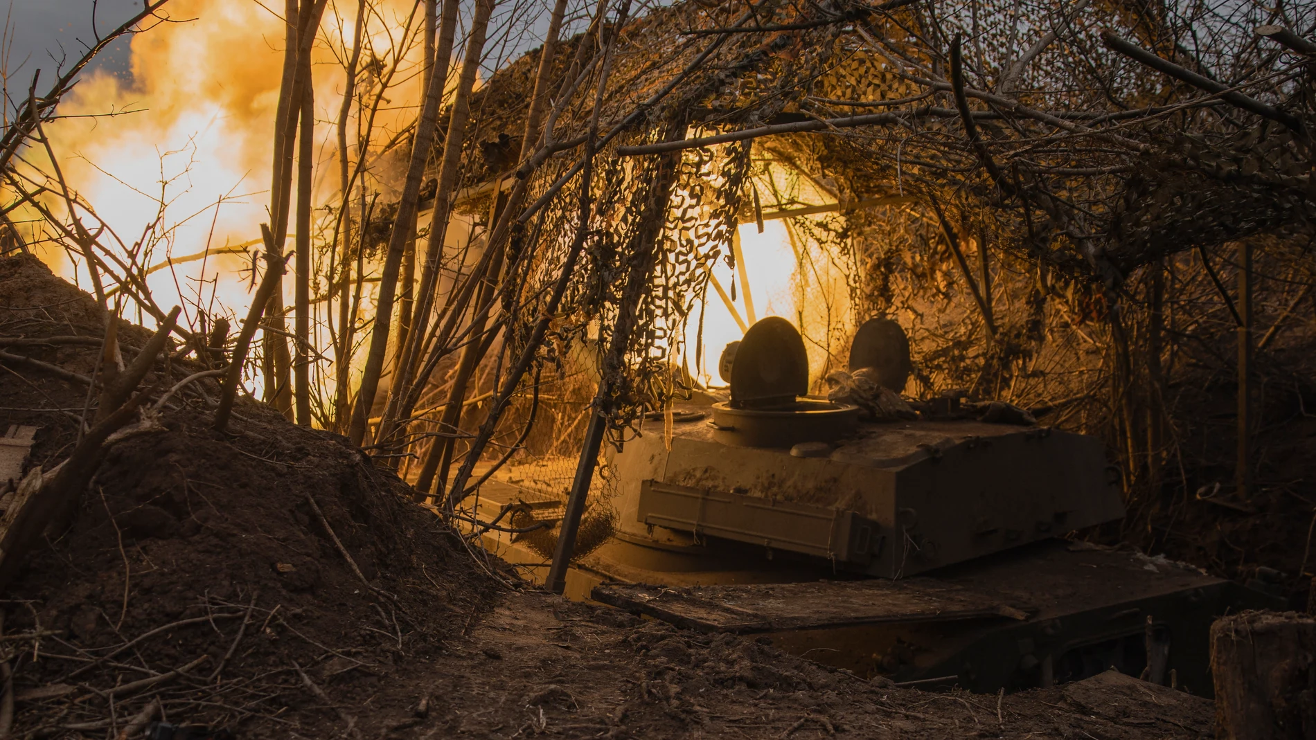 A Ukrainian self-propelled artillery vehicle Gvozdika fire towards the Russian positions on the frontline in the Donetsk region, Ukraine, Friday, Feb. 16, 2024. (Roman Chop via AP)
