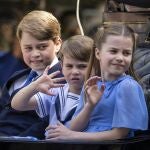 Britain's Prince George, Prince Louis and Princess Charlotte ride in a carriage on The Mall during the Platinum Jubilee celebrations for Britain's Queen Elizabeth II, in London