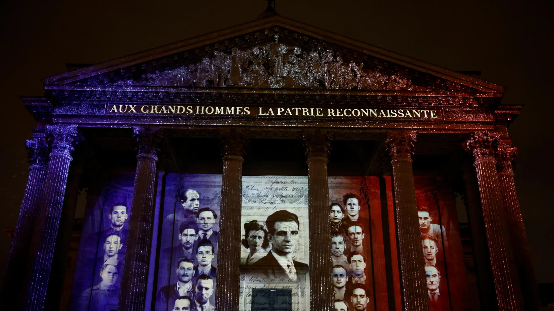 Paris (France), 21/02/2024.- Photographs of Missak and Melinee Manouchian, and his 23 resistance comrades of the FTP-MOI, are projected on the Pantheon illuminated with the colors of the French flag during the induction ceremony for Missak Manouchian, Armenian poet and communist fighter who became a figure of the World War II Resistance and who was executed at the Mont-Valerien in February 1944, and his 23 resistance comrades, into the Pantheon, where key figures from France's history are hon...