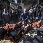 Palestinians search for survivors in Deir Al Balah after Israeli air strikes on Gaza