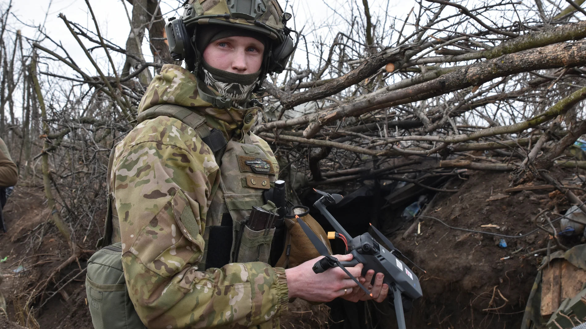 A Ukrainian soldier prepares a drone to launch on the front line in the village of Robotyne, Zaporizhzhia region, Ukraine, Friday, March 1, 2024. (AP Photo/Andriy Andriyenko)