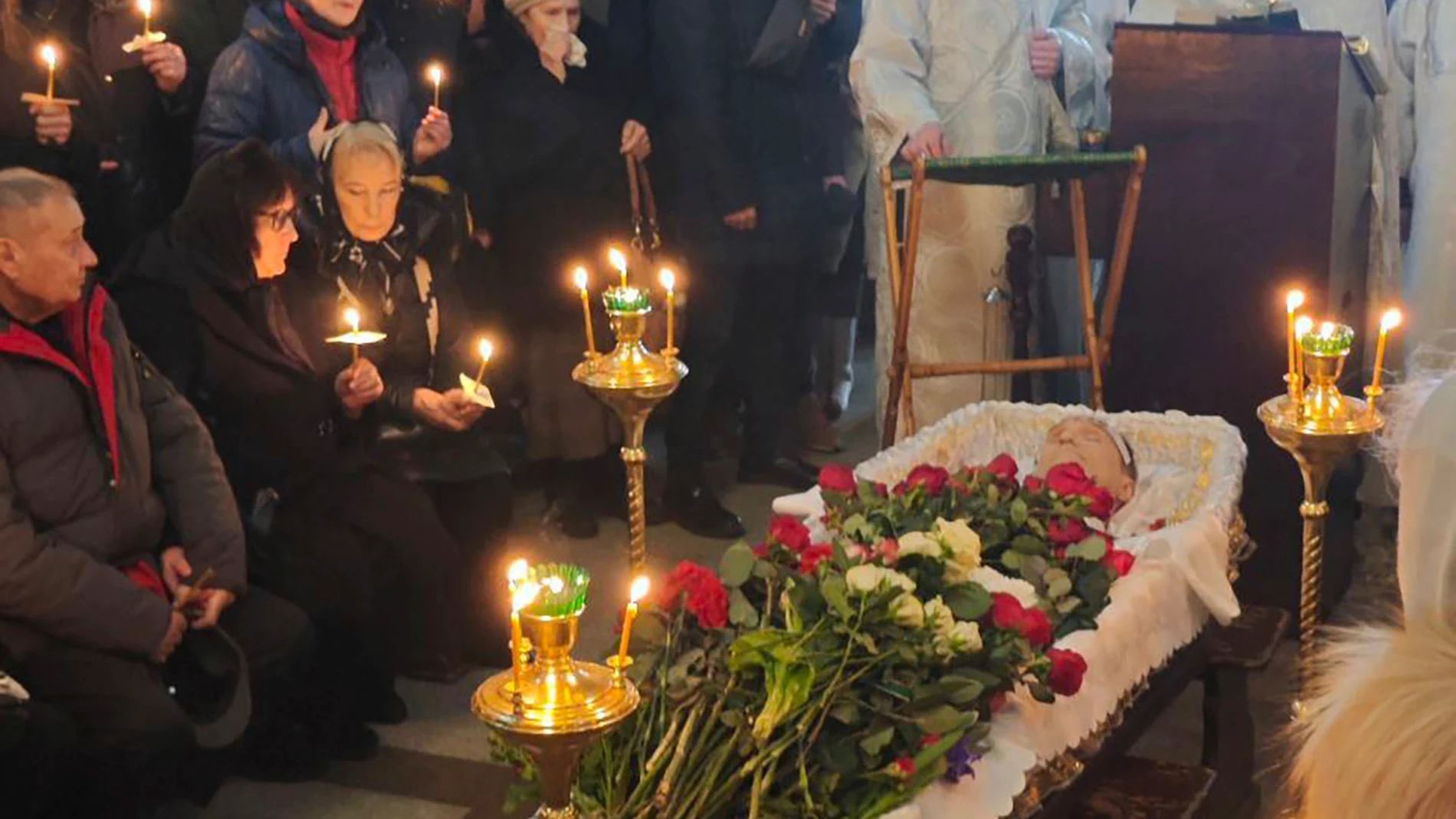 In this photo released by Navalny Team, relatives and friends pay their last respects at the coffin of Russian opposition leader Alexei Navalny in the Church of the Icon of the Mother of God Soothe My Sorrows, in Moscow, Russia, Friday, March 1, 2024. (Navalny Team via AP)