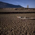 An abandoned canoe lies on the cracked ground at the Sau reservoir, which is only at 5 percent of its capacity, in Vilanova de Sau, about 100 km (62 miles) north of Barcelona, Spain
