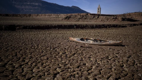 An abandoned canoe lies on the cracked ground at the Sau reservoir, which is only at 5 percent of its capacity, in Vilanova de Sau, about 100 km (62 miles) north of Barcelona, Spain
