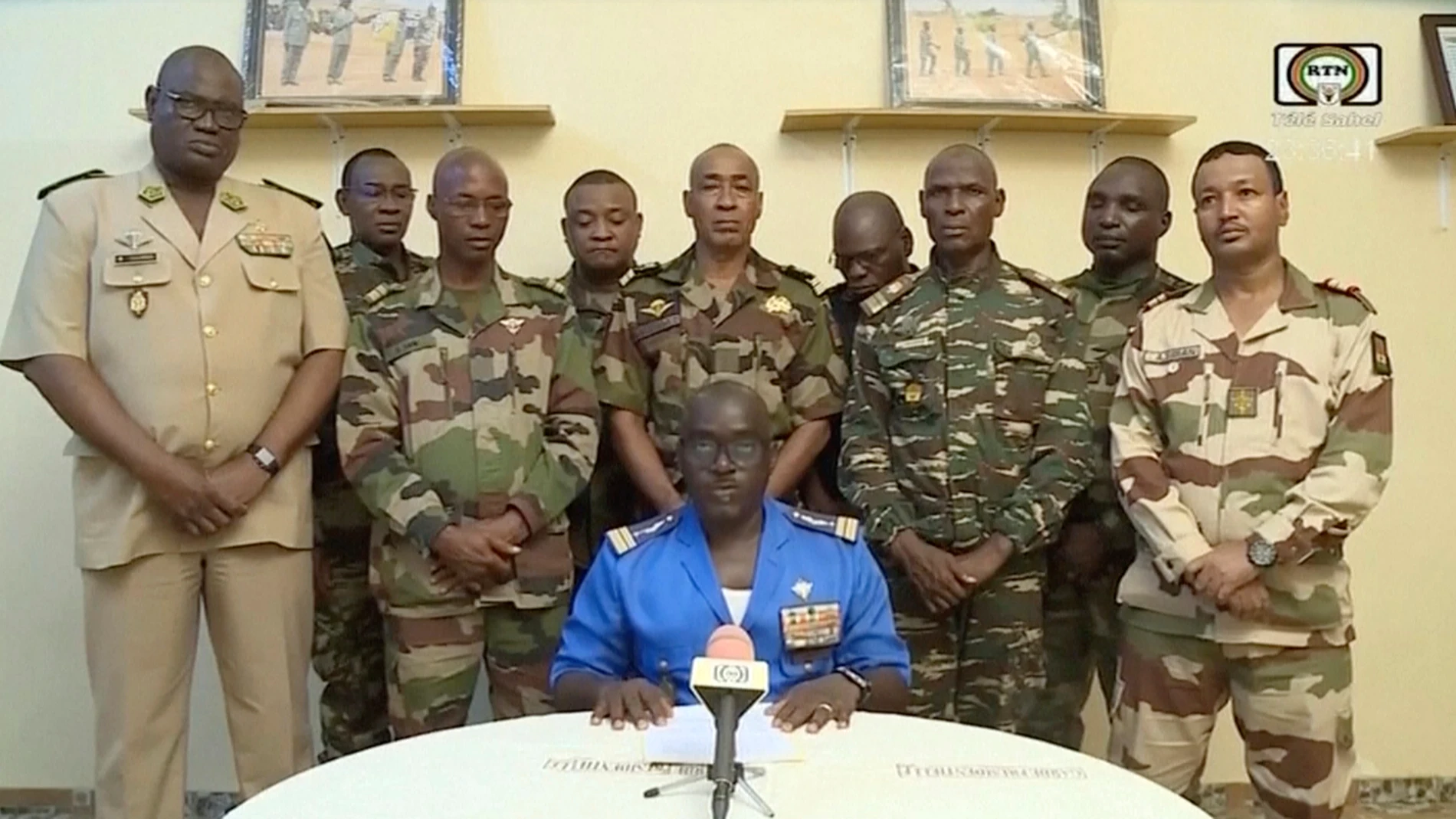 FILE - In this image taken from video provided by ORTN, Col. Maj. Amadou Abdramane, front center, makes a statement late Wednesday, July 26, 2023, in Niamey, Niger, as a delegation of military officers appeared on Niger State TV to read out a series of communiques announcing their coup d'etat. Niger's junta said Saturday, March 16, 2024, the U.S. military presence in the country is no longer justified, making the announcement on state television after holding high-level talks with U.S. diplom...
