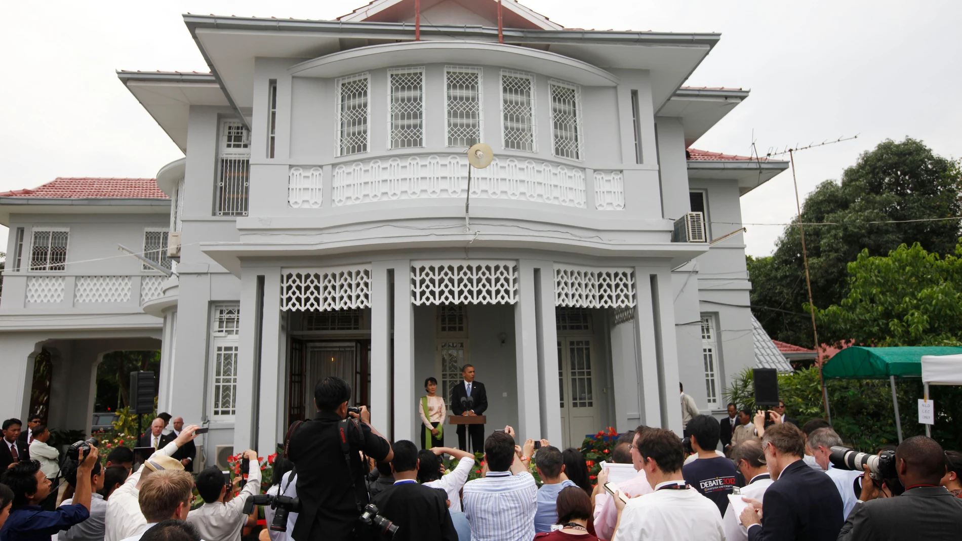 FILE - U.S. President Barack Obama, center right, and Myanmar opposition leader Aung San Suu Kyi, center left, address members of the media at Suu Kyi's residence in Yangon, Myanmar, on Nov. 19, 2012. No bidders appeared at a court-ordered auction Wednesday, March 20, 2024 of the family home of Myanmar's imprisoned former leader, Aung San Suu Kyi, where she had been held under house arrest for nearly 15 years, legal officials said. (AP Photo/Carolyn Kaster, File)