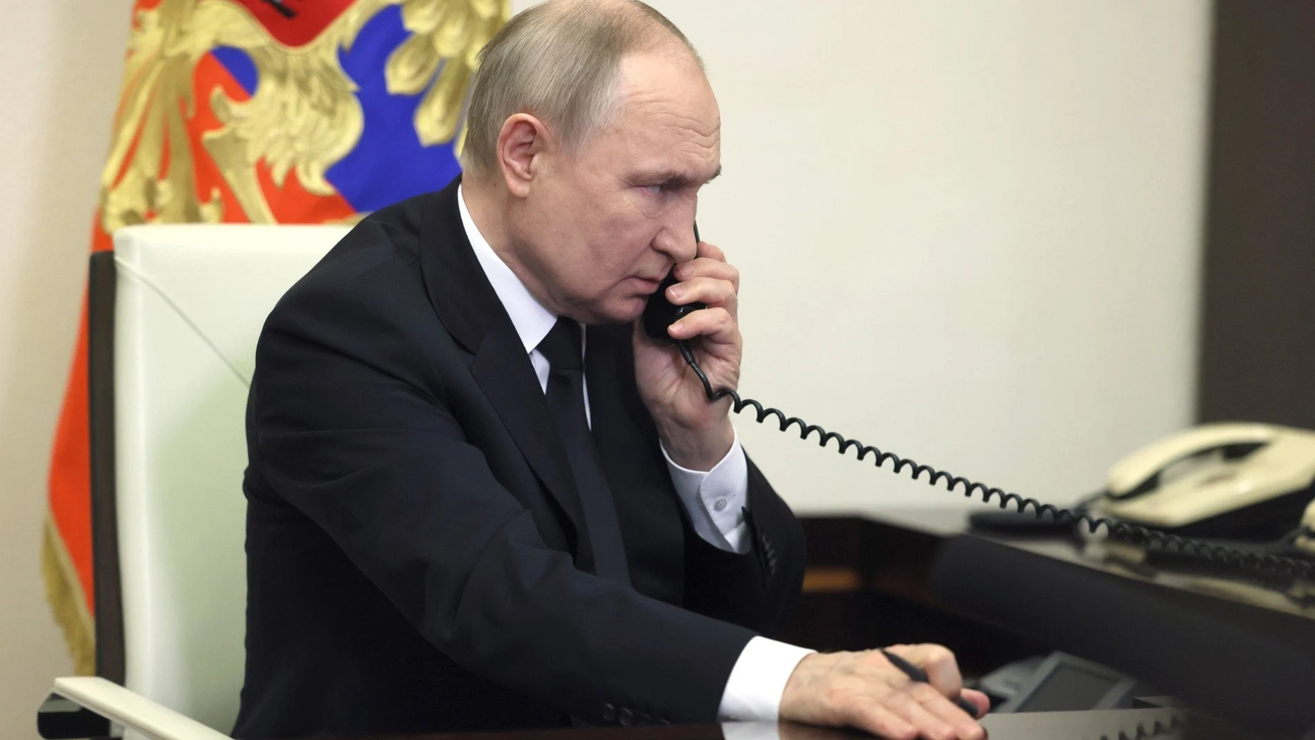 Russian President Vladimir Putin speaks over the phone during his address, the day after a terror attack on the Crocus City Hall in Krasnogorsk.