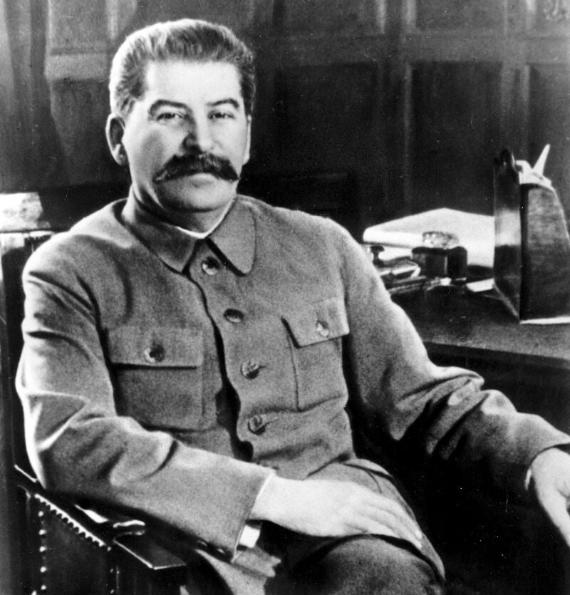Josef Stalin, secretary-general of the Communist Party of the Soviet Union and premier of the Soviet state, poses at his desk in the Kremlin, Moscow, Russia in Feb. 1950