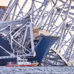 The Francis Scott Key Bridge rests partially collapsed after a cargo ship ran into it in Baltimore, Maryland, USA, 26 March 2024. 