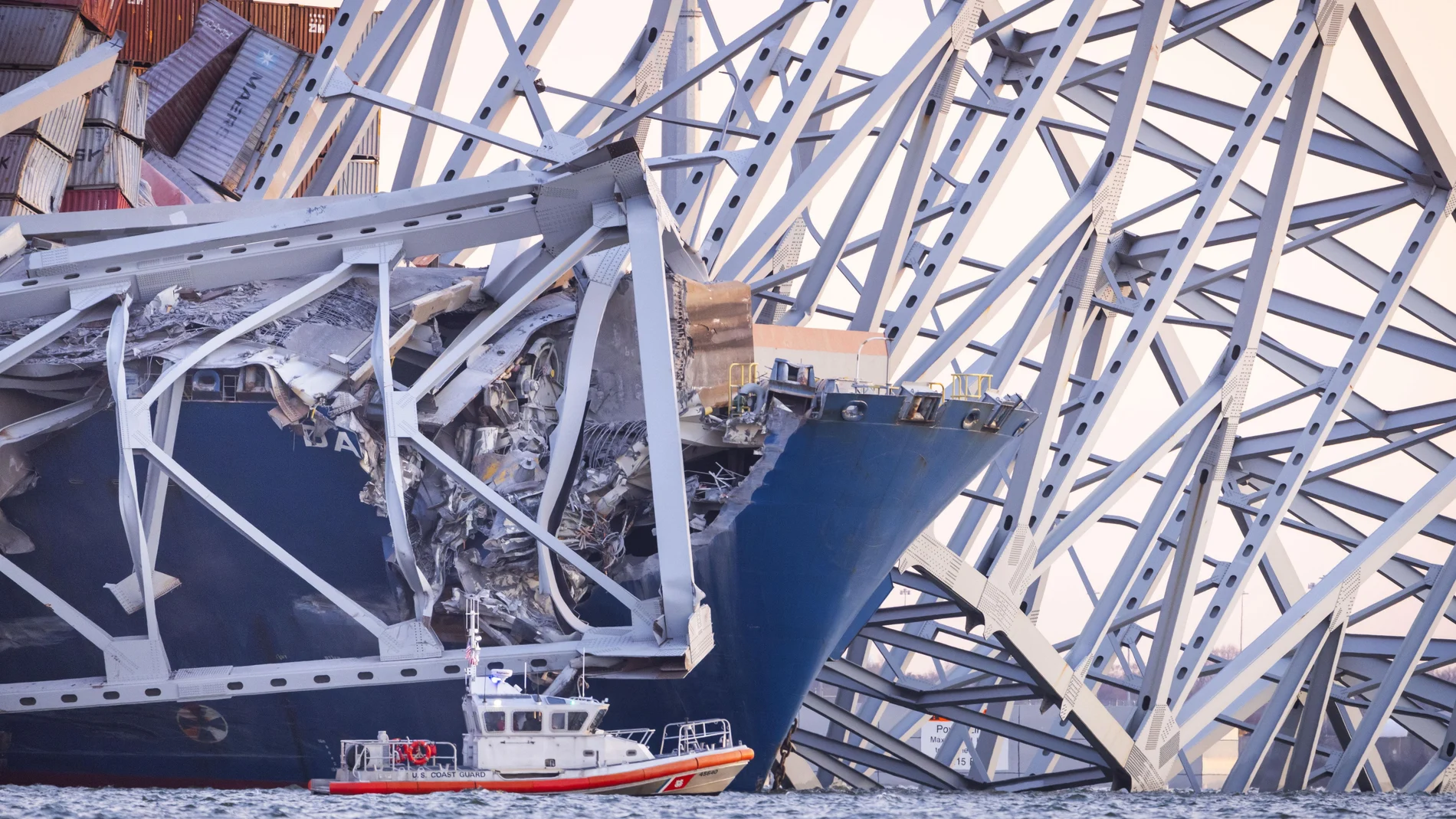 The Francis Scott Key Bridge rests partially collapsed after a cargo ship ran into it in Baltimore, Maryland, USA, 26 March 2024. 