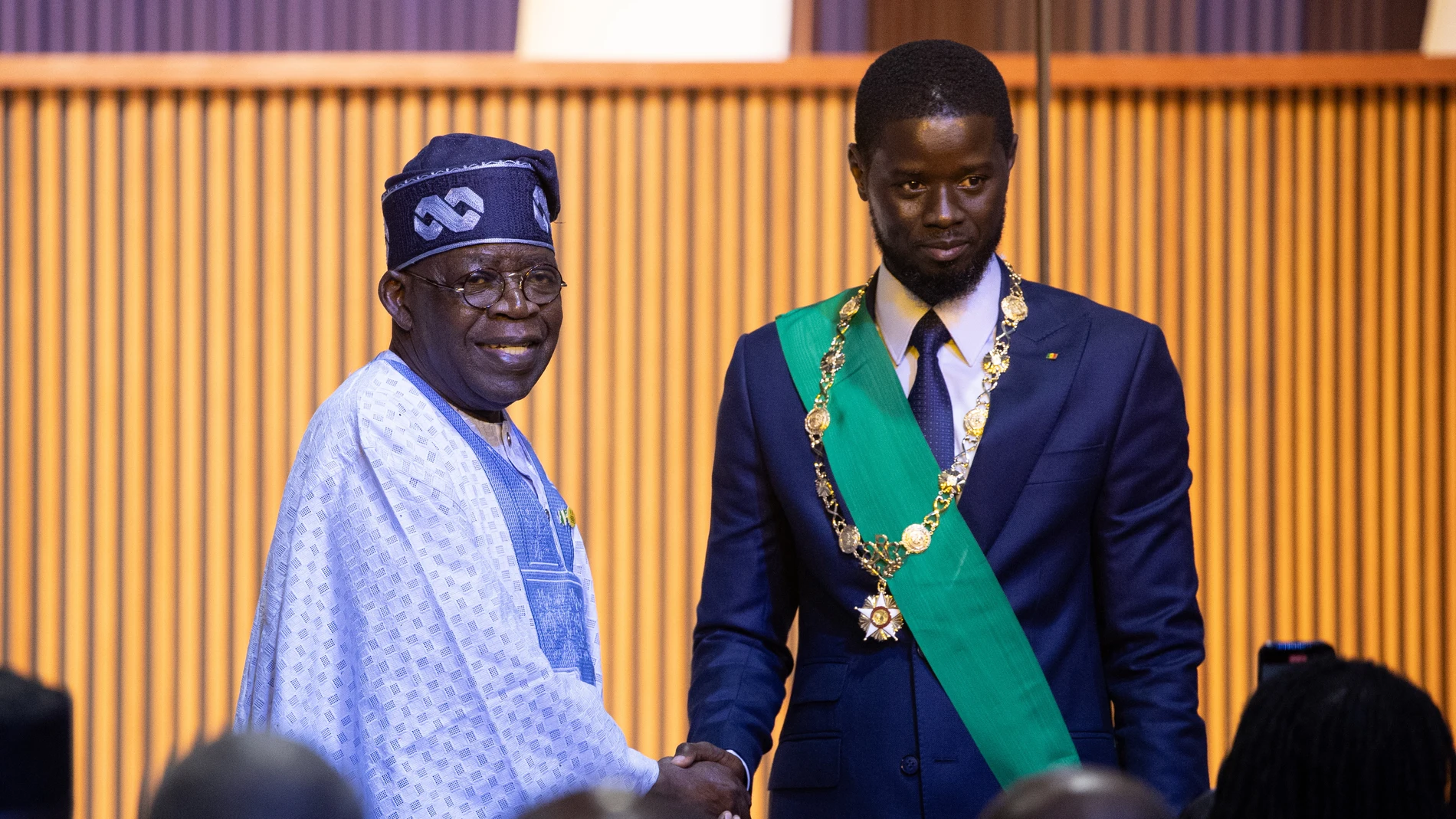 Diamniadio (Senegal), 02/04/2024.- Newly sworn in Senegalese President Bassirou Diomaye Faye (R) is congratulated by Nigerian President Bola Ahmed Tinubu (L) during his inauguration ceremony at the Abdou Diouf International Convention Centre in Diamniadio, Senegal, 02 April 2024. Faye, freed from jail on 14 March, won the election on the first round claiming 54,28 percent of the votes. EFE/EPA/JEROME FAVRE 