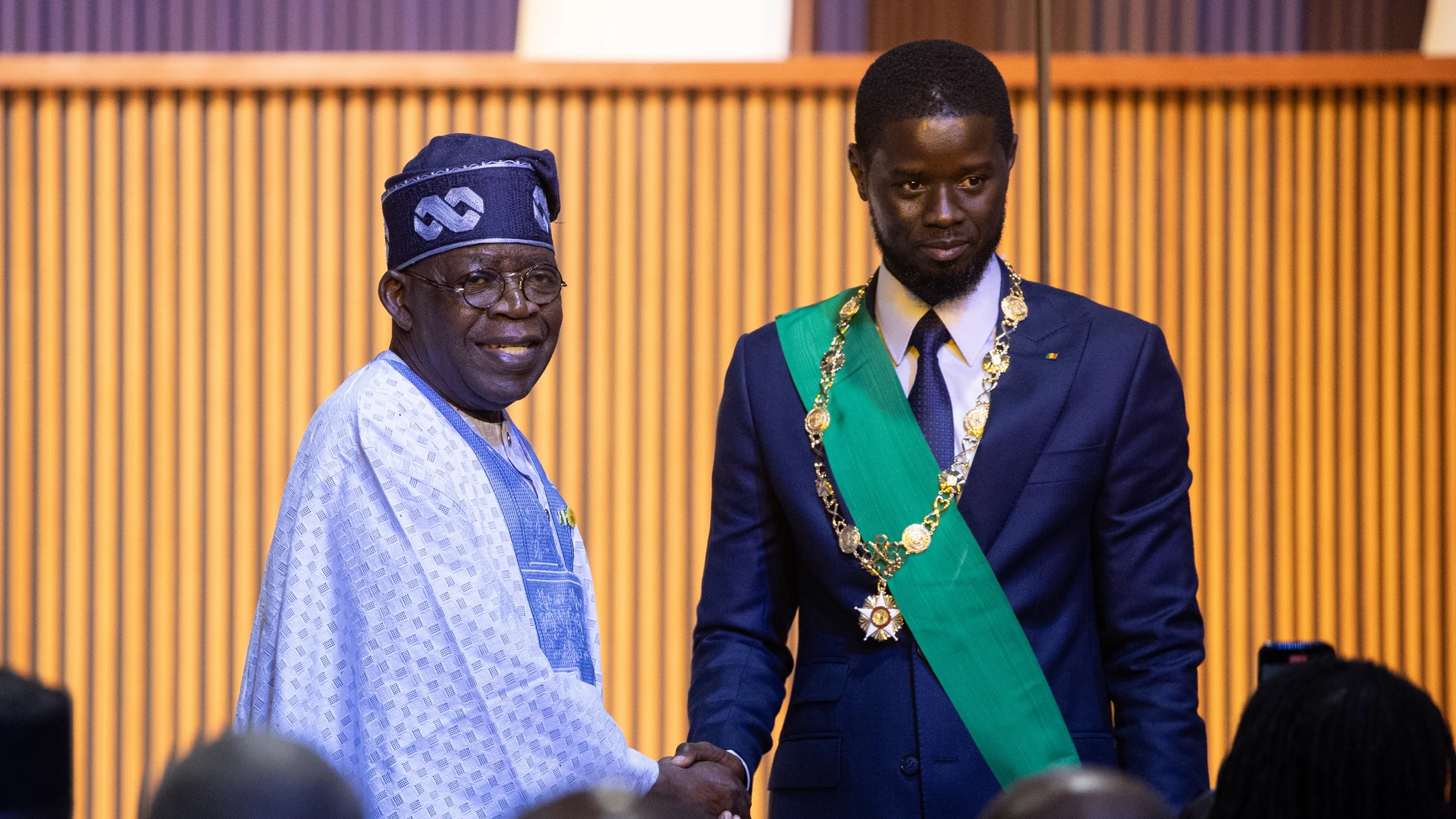 Diamniadio (Senegal), 02/04/2024.- Newly sworn in Senegalese President Bassirou Diomaye Faye (R) is congratulated by Nigerian President Bola Ahmed Tinubu (L) during his inauguration ceremony at the Abdou Diouf International Convention Centre in Diamniadio, Senegal, 02 April 2024. Faye, freed from jail on 14 March, won the election on the first round claiming 54,28 percent of the votes. EFE/EPA/JEROME FAVRE