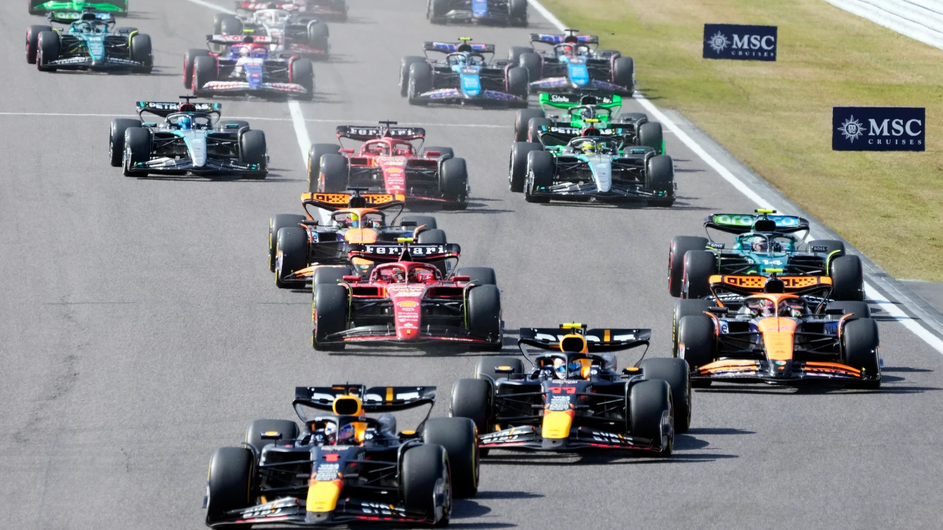 Red Bull driver Max Verstappen, left, of the Netherlands leads the field shortly after the start of the Japanese Formula One Grand Prix at the Suzuka Circuit in Suzuka, central Japan, Sunday, April 7, 2024. (AP Photo/Hiro Komae)