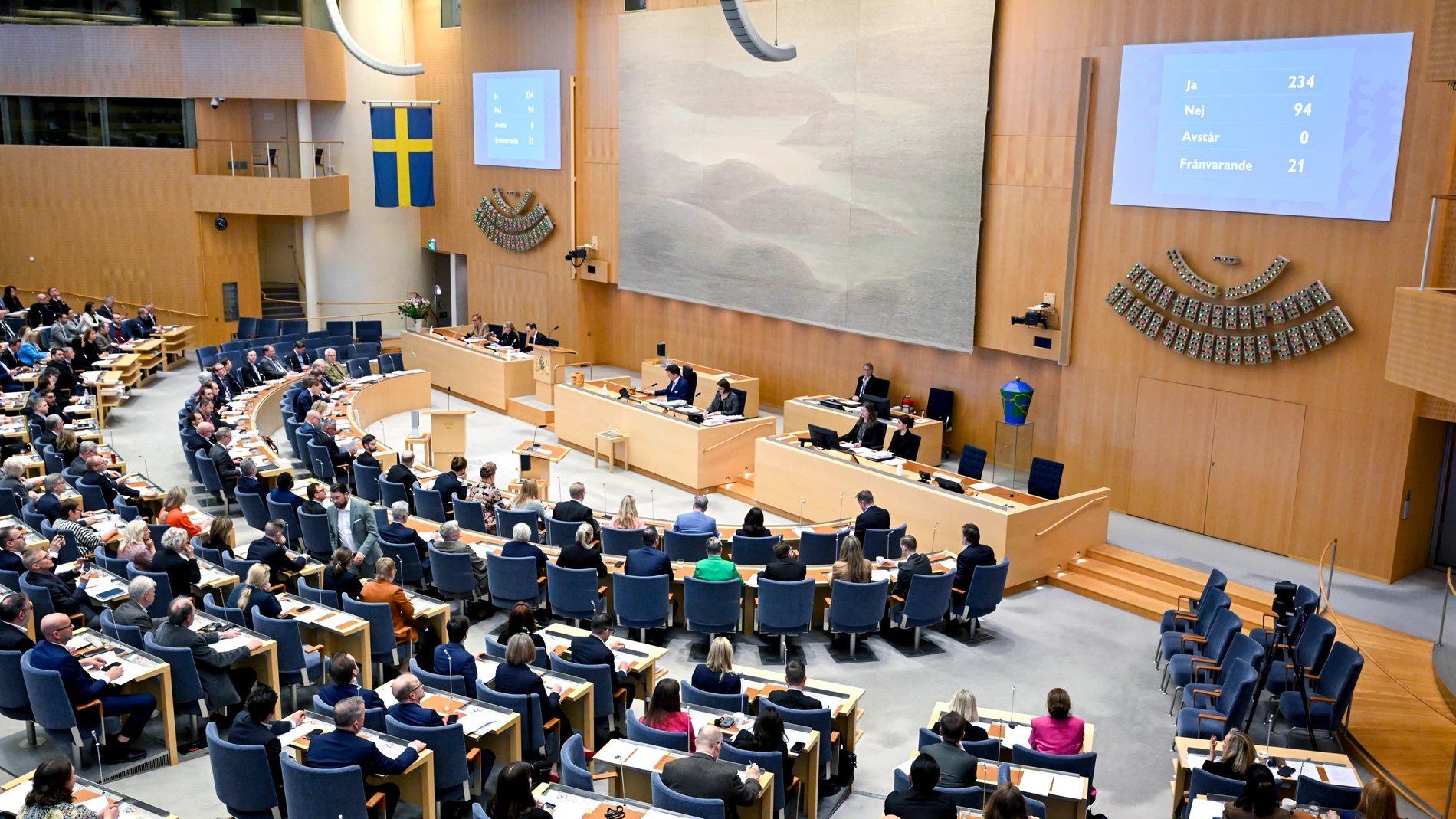 A view of the Swedish Parliament as lawmakers vote on the new gender identity law, in Stockholm, Wednesday, April 17, 2024. The Swedish parliament passed a law Wednesday lowering the age required for people to legally change their gender from 18 to 16. Young people under 18 will still need approval from a guardian, a doctor, and the National Board of Health and Welfare. The government of Prime Minister Ulf Kristersson has been split on the issue.(Jessica Gow/TT News Agency via AP)