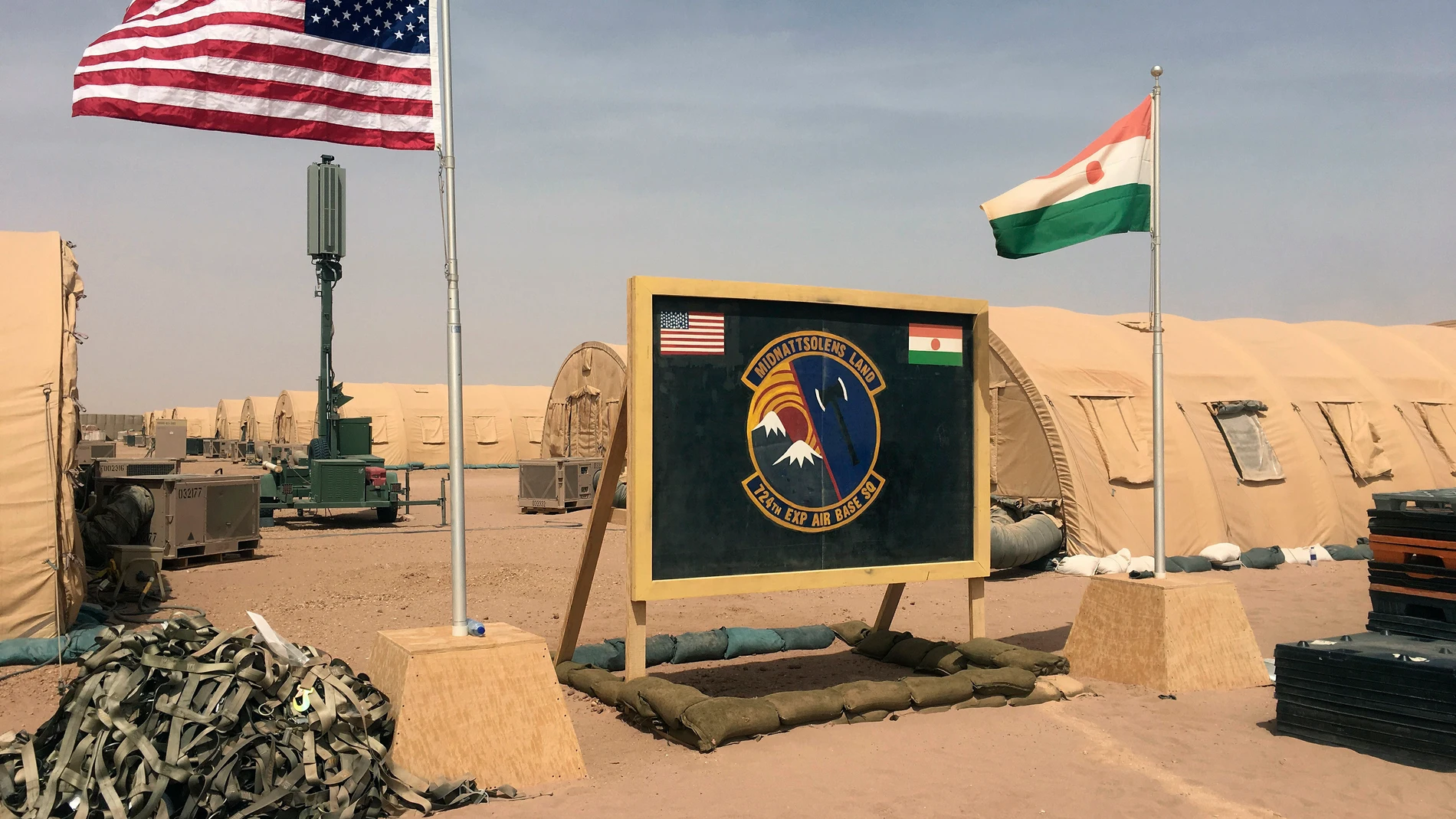 FILE - A U.S. and Niger flag are raised side by side at the base camp for air forces and other personnel supporting the construction of Niger Air Base 201 in Agadez, Niger, April 16, 2018. The United States is attempting to create a new military agreement with Niger that would allow it to remain in the country, weeks after the junta said its presence was no longer justified, two Western officials told The Associated Press Friday April 19, 2024. (AP Photo/Carley Petesch, File)