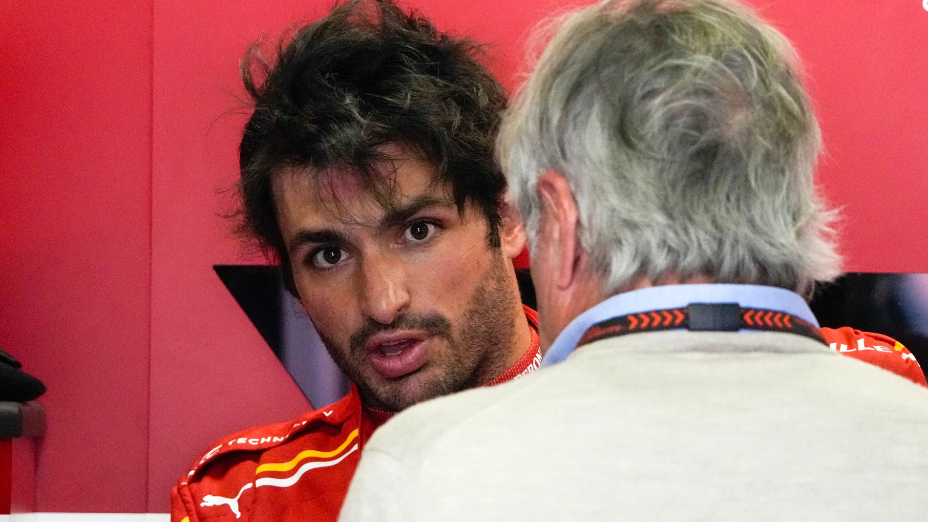 Ferrari driver Carlos Sainz of Spain reacts following the first practice session for the Chinese Formula One Grand Prix at the Shanghai International Circuit, Shanghai, China, Friday, April 19, 2024. (AP Photo/Andy Wong)