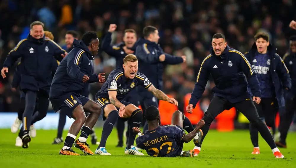 Real Madrid's Antonio Rudiger (C) celebrates victory with teammates after winning a penalty shoot out following the UEFA Champions League quarter-final second leg soccer match between Manchester City and Real Madrid at the Etihad Stadium, Manchester. 