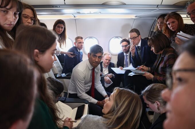 UK Prime Minister Rishi Sunak speaks to journalists on board a plane on his way to Warsaw during his visit to Poland and Germany. 