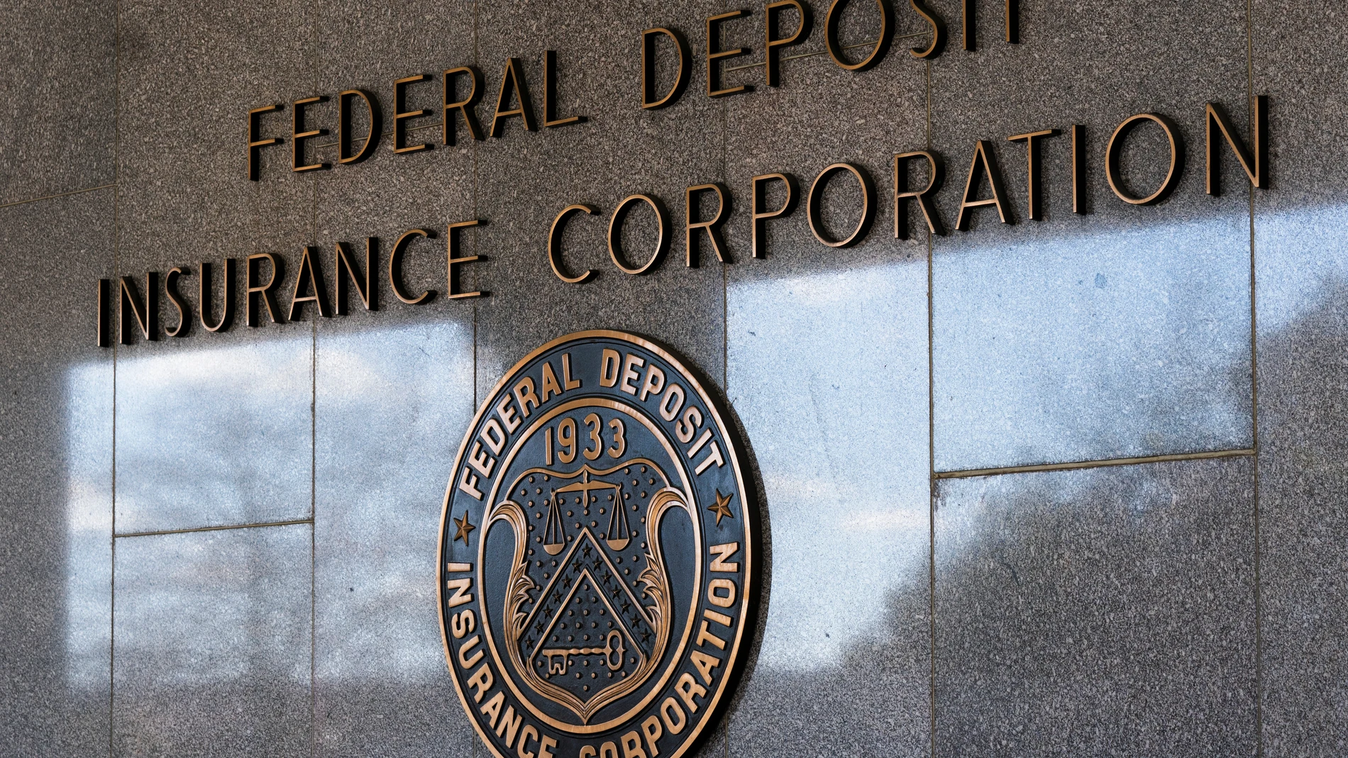 FILE - The Federal Deposit Insurance Corporation (FDIC) seal is shown outside its headquarters, March 14, 2023, in Washington. Regulators have closed Republic First Bank, a regional lender operating in Pennsylvania, New Jersey and New York. The FDIC said Friday, April 26, 2024, it had seized the Philadelphia-based bank, which had roughly $6 billion in assets and $4 billion in deposits as of Jan. 31. (AP Photo/Manuel Balce Ceneta, File)