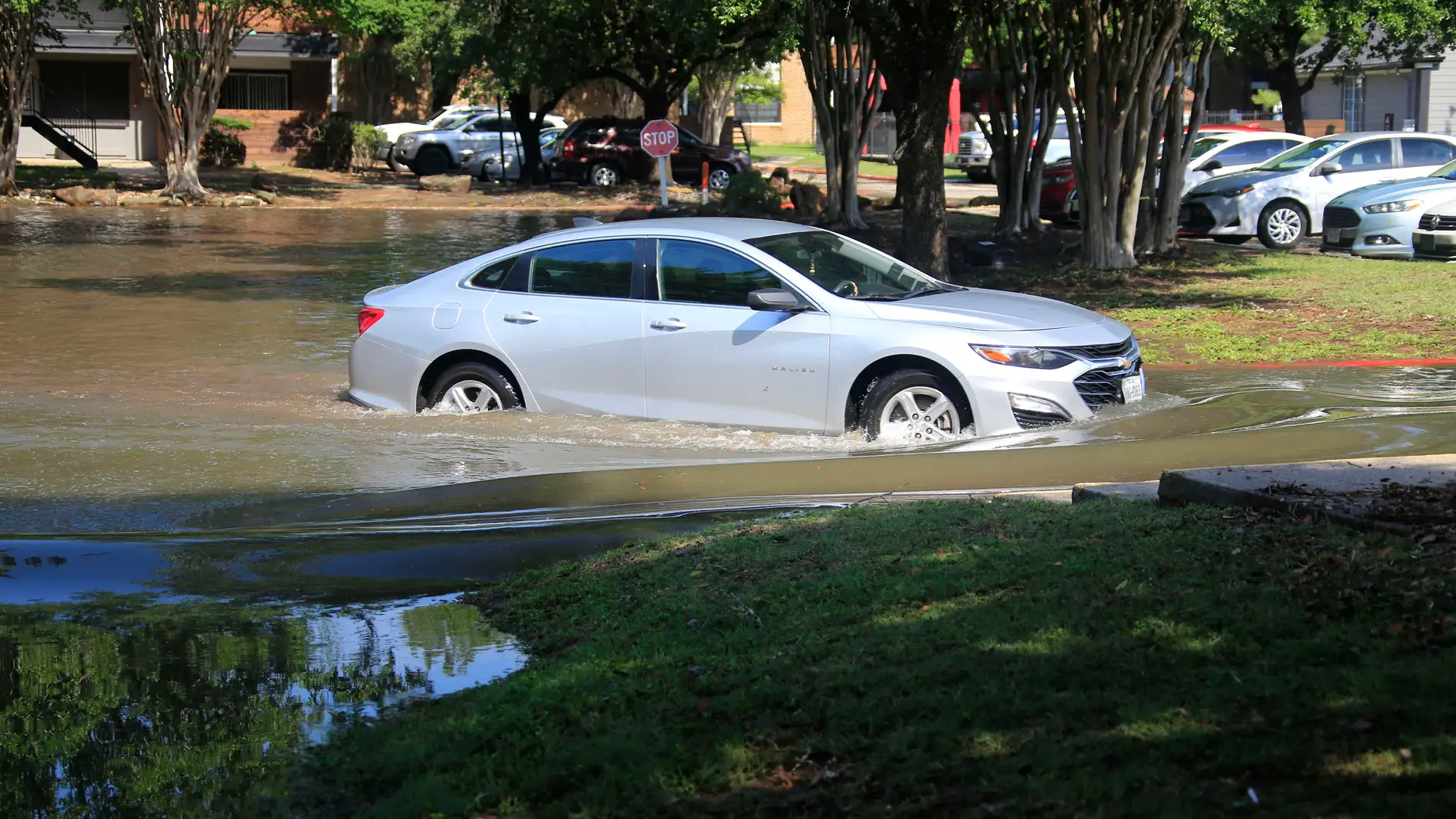 TEXAS, May 3, 2024 -- A car is seen in floodwaters in a residential area in Spring, Texas, the United States, May 2, 2024. Multiple rounds of thunderstorms are worsening flooding threats on Thursday across eastern Texas, including the Houston area, forcing evacuations and school closures. 02/05/2024