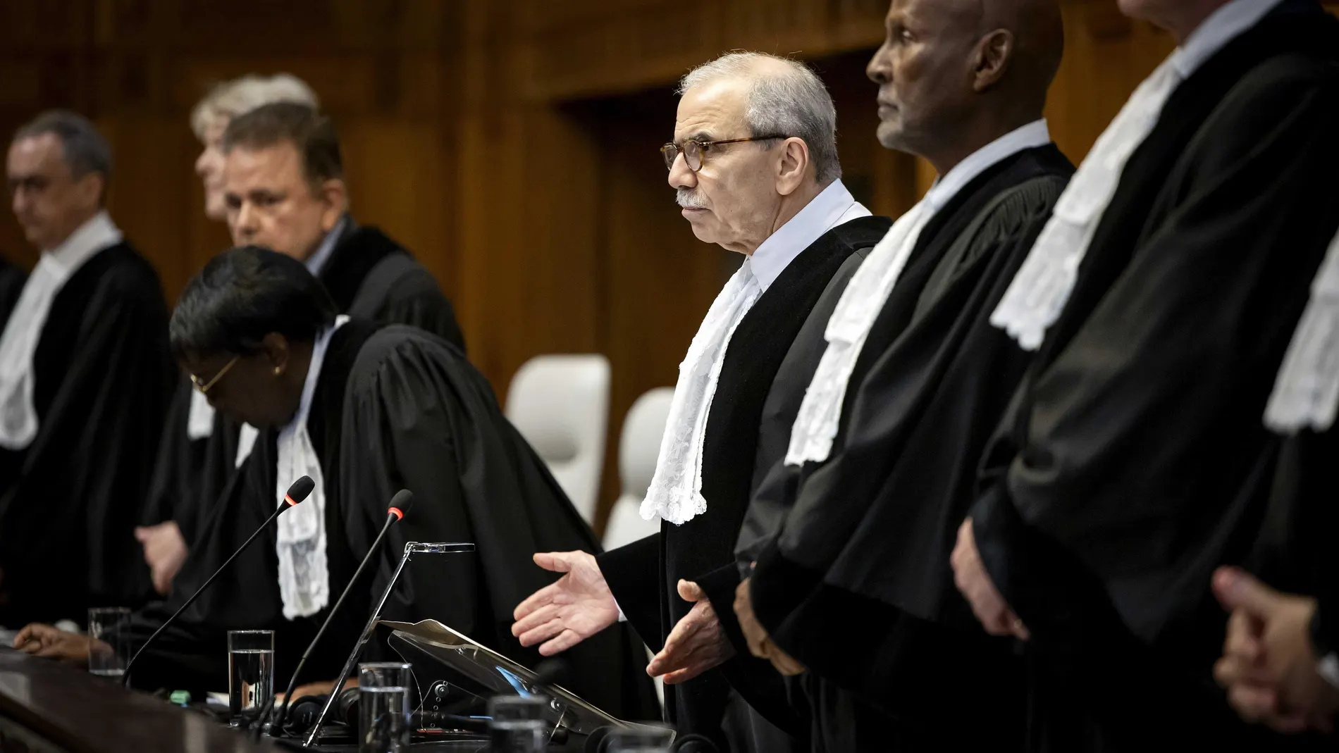 The Hague (Netherlands), 24/05/2024.- International Court of Justice (ICJ) President Nawaf Salam (C) stands during an ICJ ruling over the situation in Rafah, southern Gaza Strip, in the Hague, Netherlands, 24 May 2024. The ICJ on 24 May ordered Israel to halt its military operation in Rafah, to open the Rafah border crossing with Egypt to allow for the entry of humanitarian aid, to allow access to Gaza for investigators, and to report to the court within one month on its progress. (Egipto, Pa...