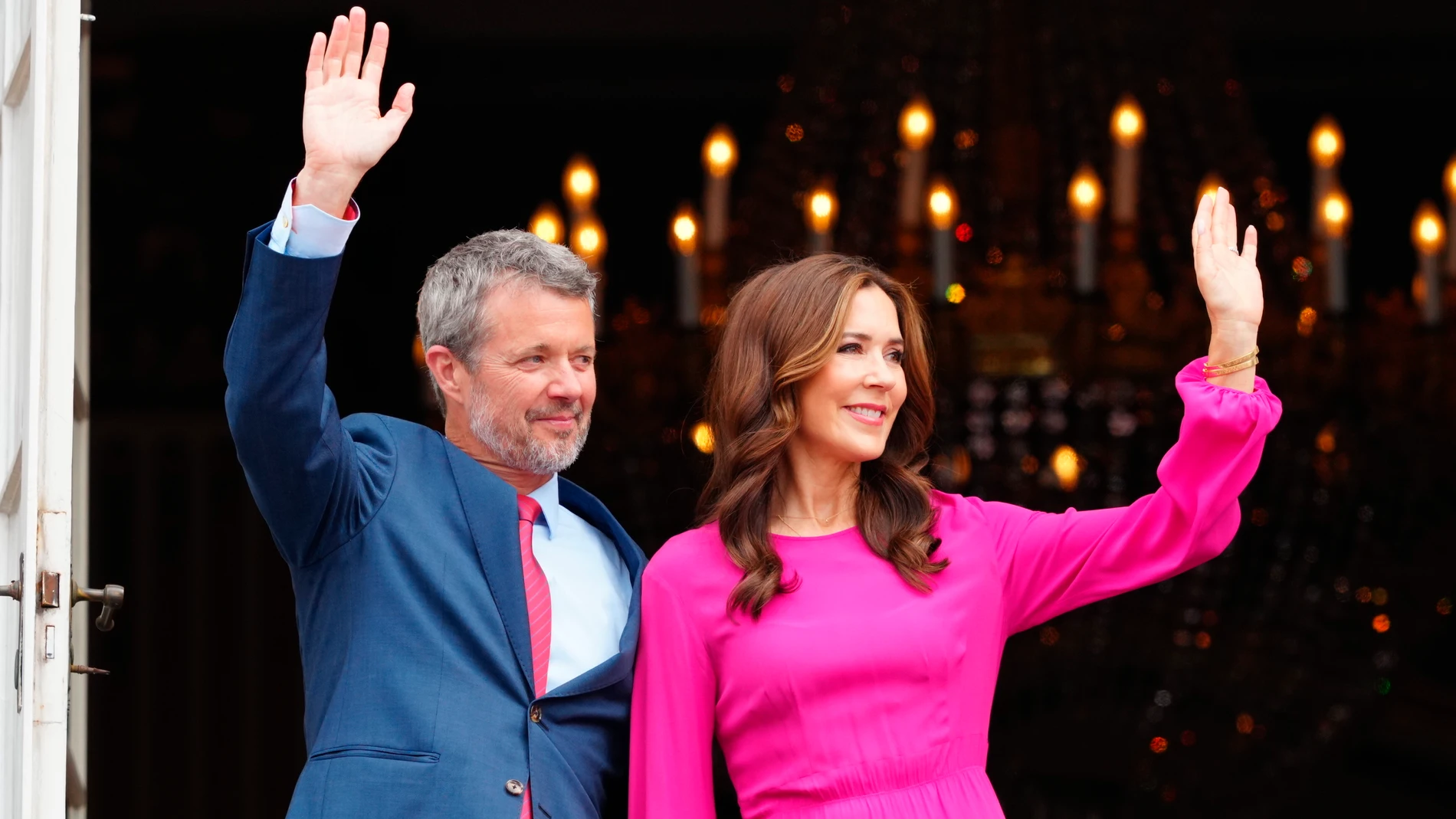 Denmark's King Frederik X, celebrating his 56th birthday, waves from the balcony with his wife Queen Mary at Frederik VIII's Palace, Amalienborg Castle in Copenhagen, Sunday, May 26, 2024. (Ida Marie Odgaard/Ritzau Scanpix via AP)