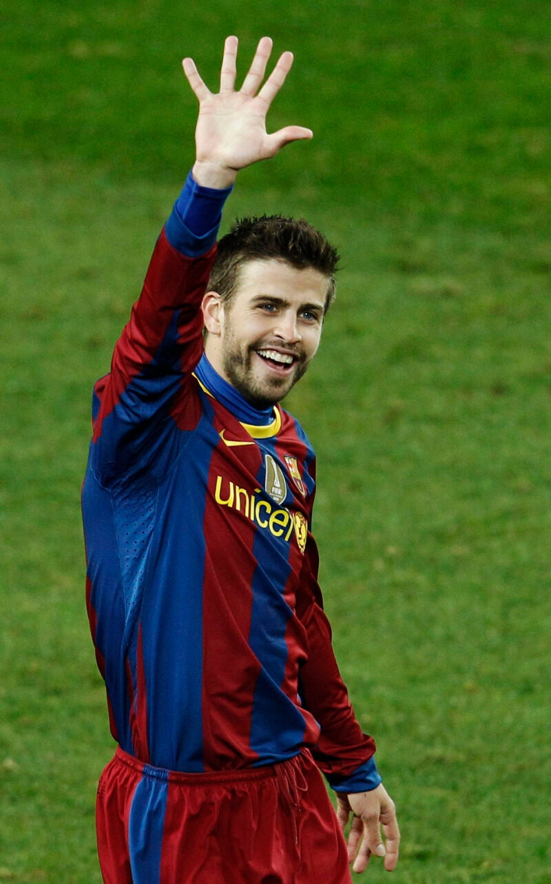 Barcelona's Gerard Pique celebrates his team's fifth goal during the La Liga soccer match against Real Madrid at the Camp Nou stadium, in Barcelona.