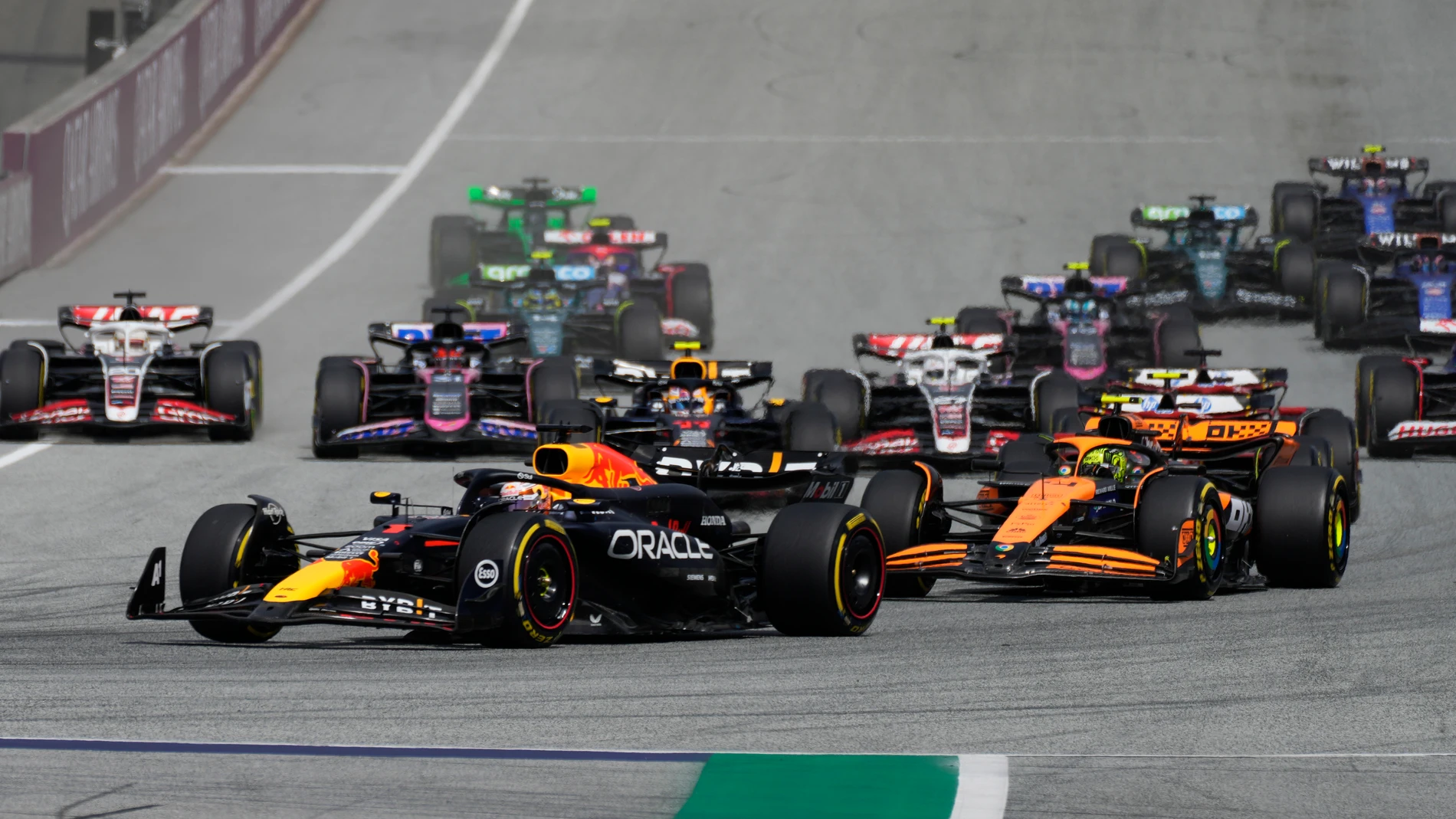 Red Bull driver Max Verstappen of the Netherlands, front, leads the field after the start during the Austrian Formula One Grand Prix race at the Red Bull Ring racetrack in Spielberg, Austria, Sunday, June 30, 2024. (AP Photo/Darko Bandic)