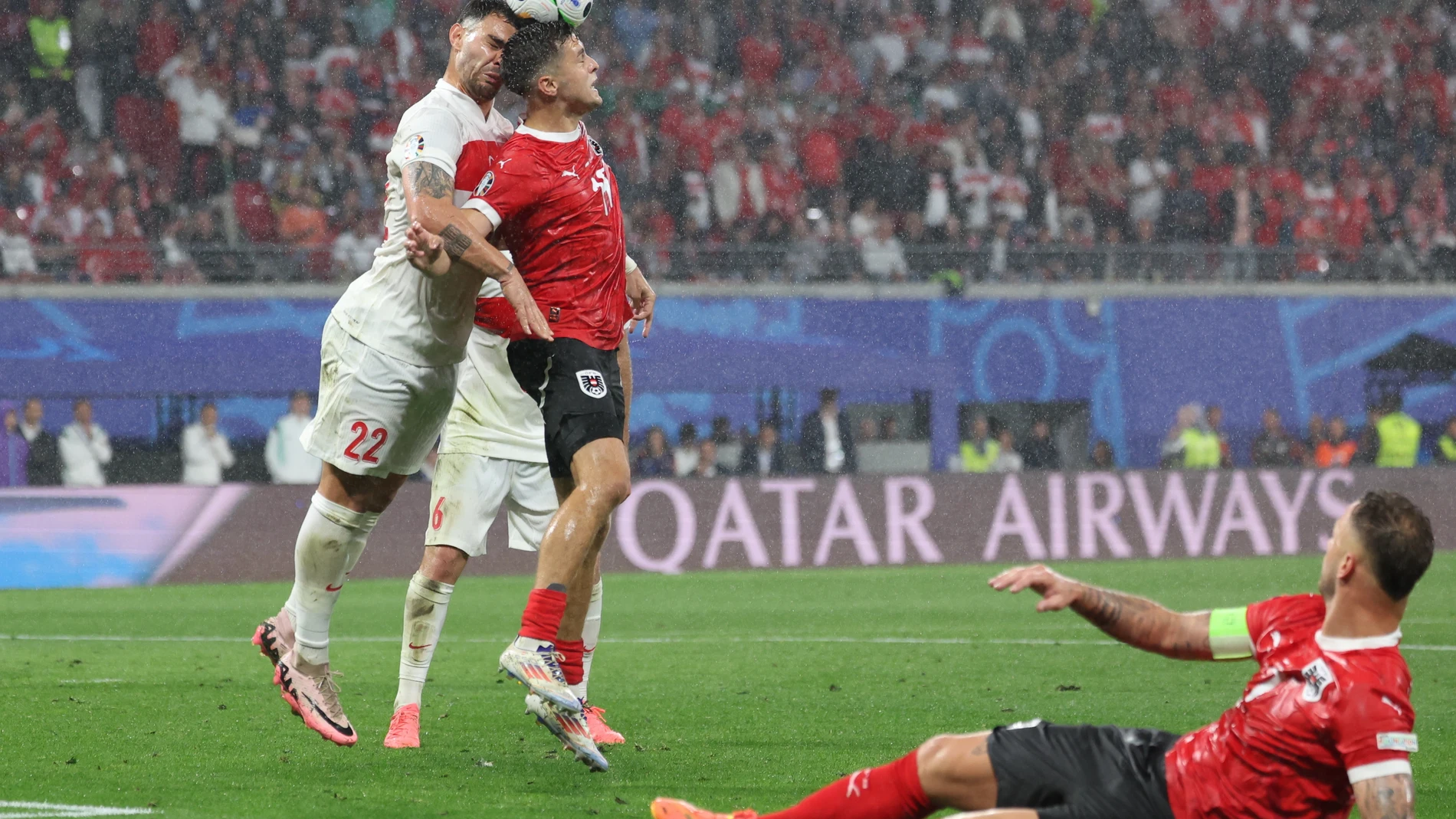 Leipzig (Germany), 02/07/2024.- Kaan Ayhan of Turkey (L) and Christoph Baumgartner of Austria (2L) in action during the UEFA EURO 2024 Round of 16 soccer match between Austria and Turkey, in Leipzig, Germany, 02 July 2024. (Alemania, Turquía) EFE/EPA/CHRISTOPHER NEUNDORF