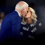 President Joe Biden and first lady Jill Biden embrace for a kiss at an campaign rally in Raleigh, N.C., Friday, June. 28, 2024. 