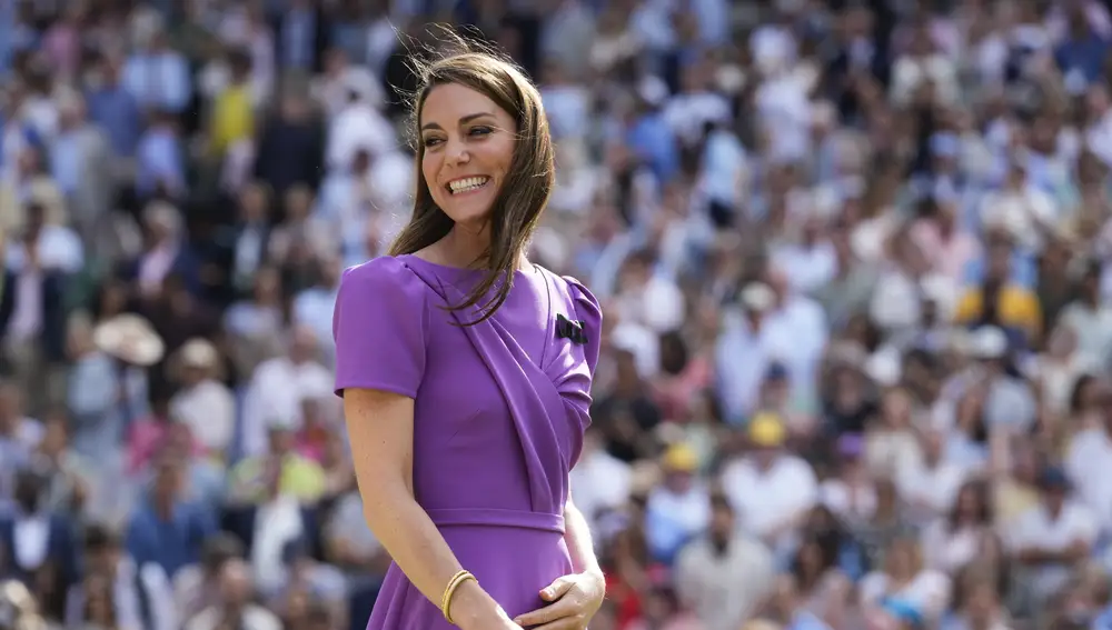 Kate, Princess of Wales, smiles as she waits to present the trophy to Carlos Alcaraz of Spain at the men's singles final at the Wimbledon tennis championships in London, July 14, 2024. (AP Photo/Kirsty Wigglesworth)
