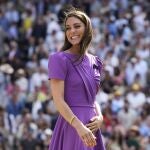 Kate, Princess of Wales, smiles as she waits to present the trophy to Carlos Alcaraz of Spain at the men's singles final at the Wimbledon tennis championships in London, July 14, 2024. (AP Photo/Kirsty Wigglesworth)