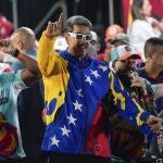 President Nicolas Maduro dances outside the Miraflores presidential palace after electoral authorities declared him the winner of the presidential election in Caracas, Venezuela, Monday, July 29, 2024. 