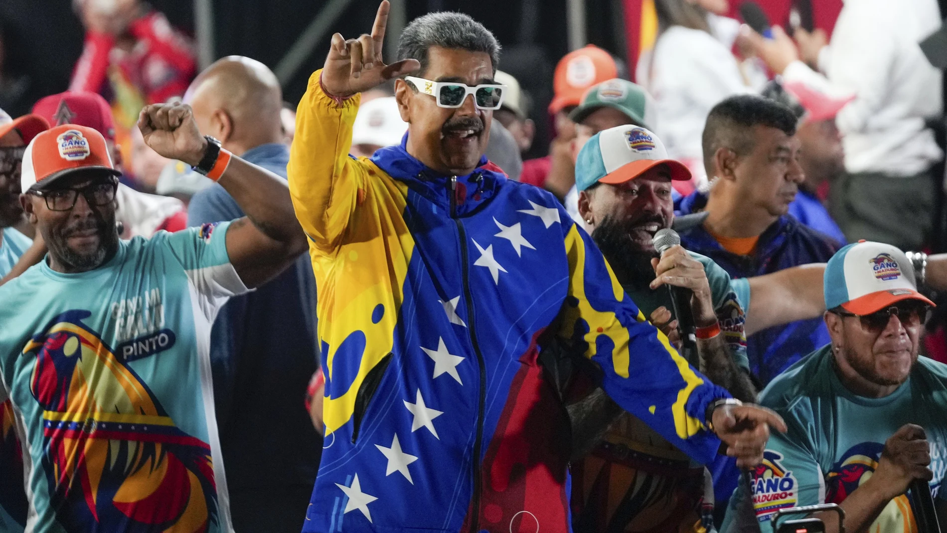 President Nicolas Maduro dances outside the Miraflores presidential palace after electoral authorities declared him the winner of the presidential election in Caracas, Venezuela, Monday, July 29, 2024.