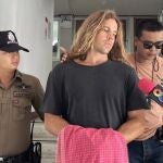 A Spanish chef alleged murder suspect Daniel Sancho (C), is escorted by Thai police officers to the court from Koh Phangan police station in Koh Phangan island, southern Thailand