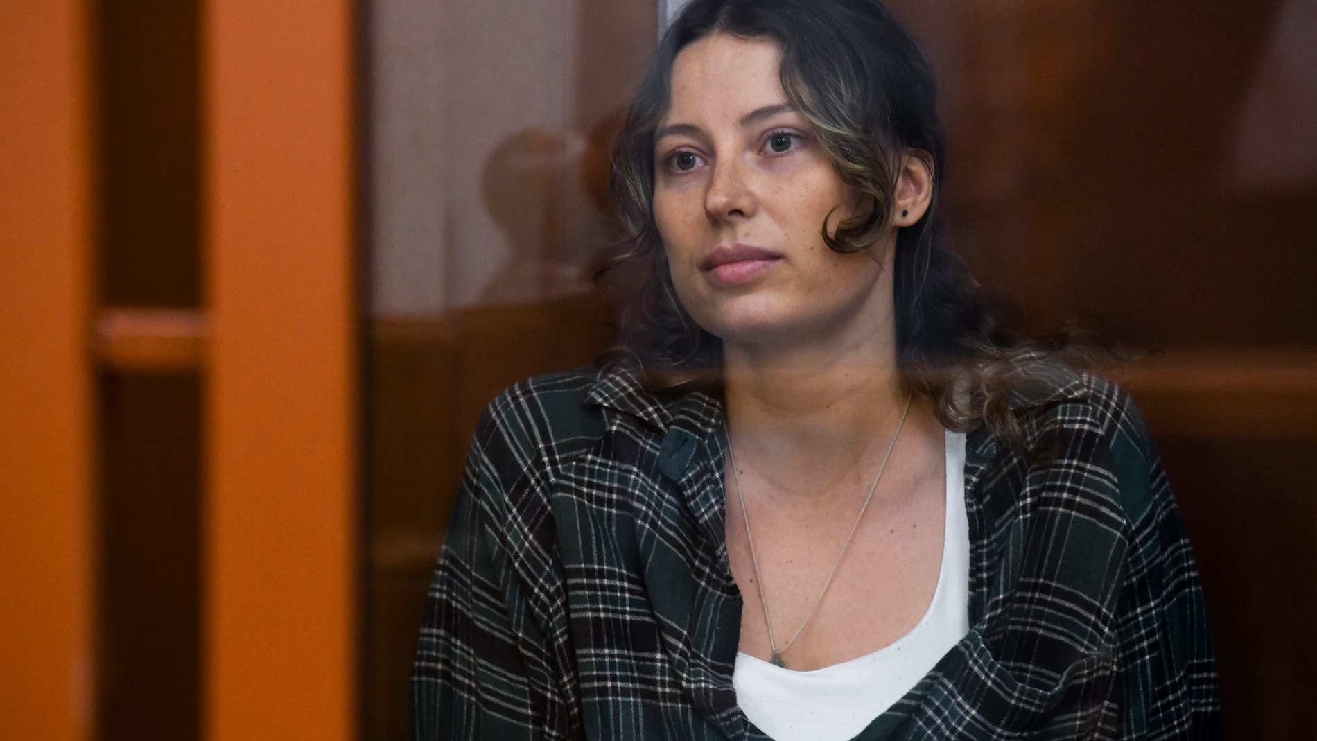 FILE - Ksenia Karelina, also known by the last name of Khavana, sits in a defendant's cage in a court in Yekaterinburg, Russia, on Thursday, June 20, 2024. (AP Photo, File)