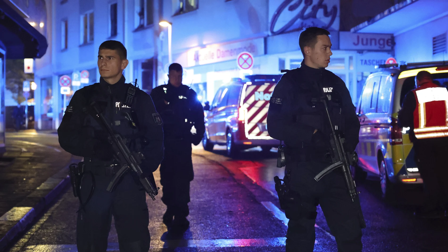 Police and ambulances near the scene where people were killed and injured in an attack at a festival in Solingen, western Germany, the German dpa news agency reported, Friday, Aug. 23, 2024.