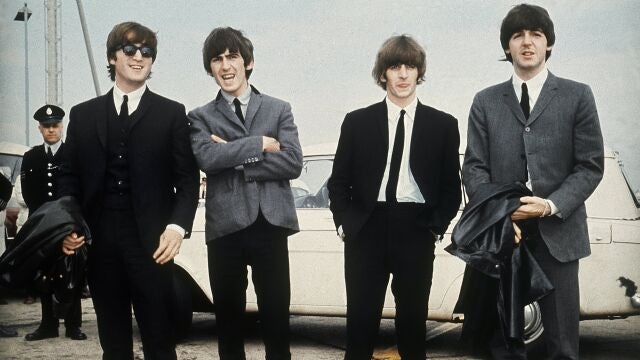 The Beatles, from left, John Lennon, George Harrison, Ringo Starr and Paul McCartney arrive in Liverpool, England on July 10, 1964, for the premiere of their movie "A Hard Day's Night."