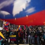 Venezuelans protest the reelection of Venezuelan President Nicolas Maduro one month after the disputed presidential vote which the opposition claims it won by a landslide, in Santiago, Chile, Wednesday, Aug. 28, 2024. 