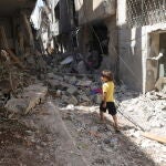 Palestinians inspect the damage after Israeli army raid in West Bank's Nur Shams camp