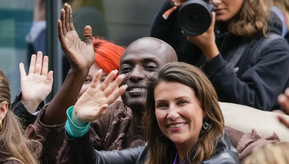 Norwegian Princess Martha Louise (R) and her partner, US businessman Durek Verrett (C) arrive in the village of Geiranger, western Norway, 30 August 2024. On 31 August, the Norwegian princess and her partner will get married at Hotel Union in the village of Geiranger.