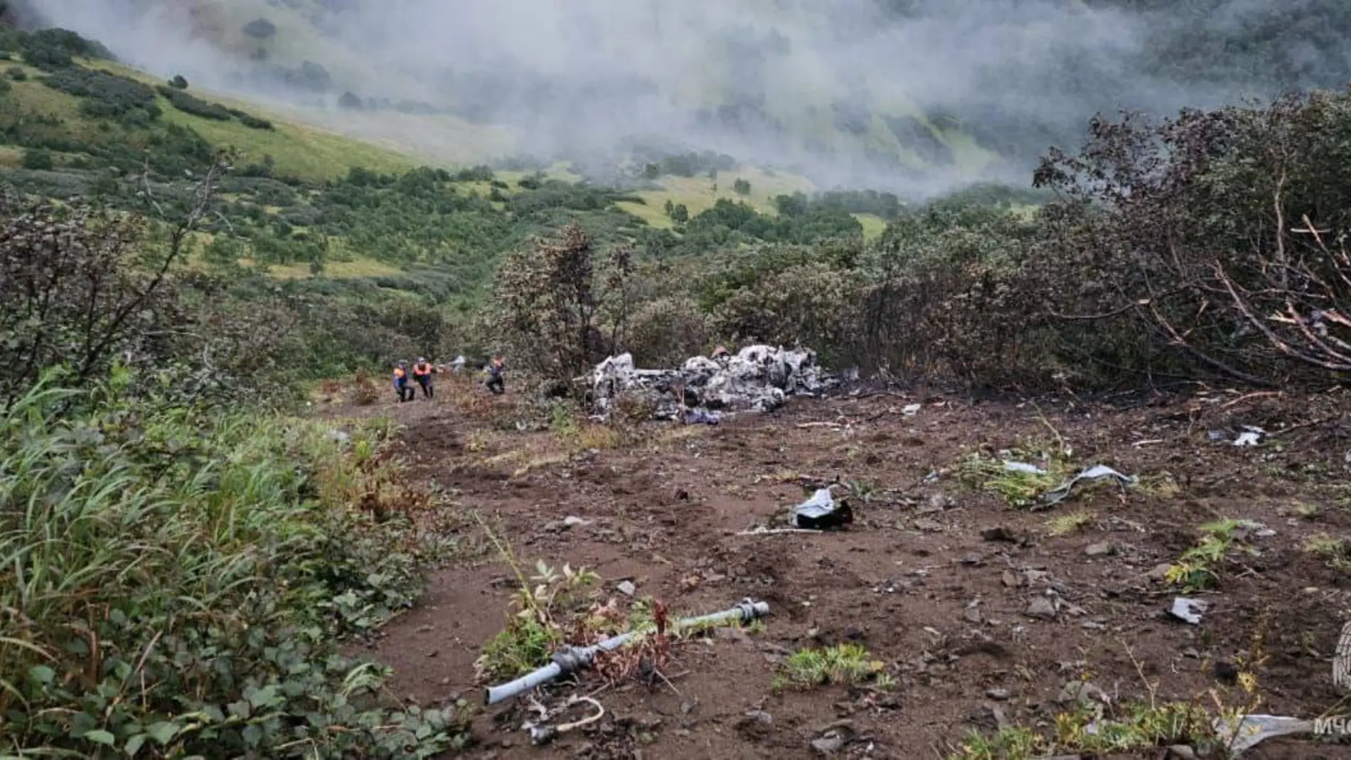 KAMCHATKA, Sept. 1, 2024 -- This photo released by Russian Ministry of Emergency Situations on Sept. 1, 2024 shows rescuers searching the site of a helicopter crash in the Kamchatka Peninsula, Russia. Seventeen bodies have been found after a Russian Mi-8 helicopter crashed in the Kamchatka Peninsula, the Russian Ministry of Emergency Situations said Sunday. The helicopter went missing on Saturday with 19 tourists and three crew members on board, according to preliminary data from the Russia'...