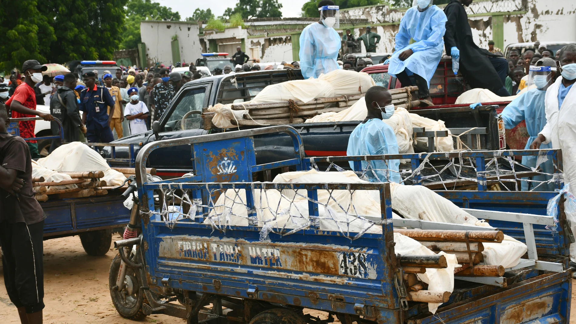 Bodies of people killed by suspected Boko Haram Islamist extremists are transported for burial, in Tarmuwa, northeast Nigeria, Tuesday, Sept. 3, 2024. (AP Photo/Michael Abu)