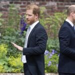 FILE - Prince Harry, left, and Prince William stand together during the unveiling of a statue they commissioned of their mother Princess Diana, on what would have been her 60th birthday, in the Sunken Garden at Kensington Palace, London, Thursday July 1, 2021. Prince Harry has said he wants to have his father and brother back and that he wants “a family, not an institution,” during a TV interview ahead of the publication of his memoir. The interview with Britainís ITV channel is due to be released this Sunday. (Dominic Lipinski /Pool Photo via AP, File)