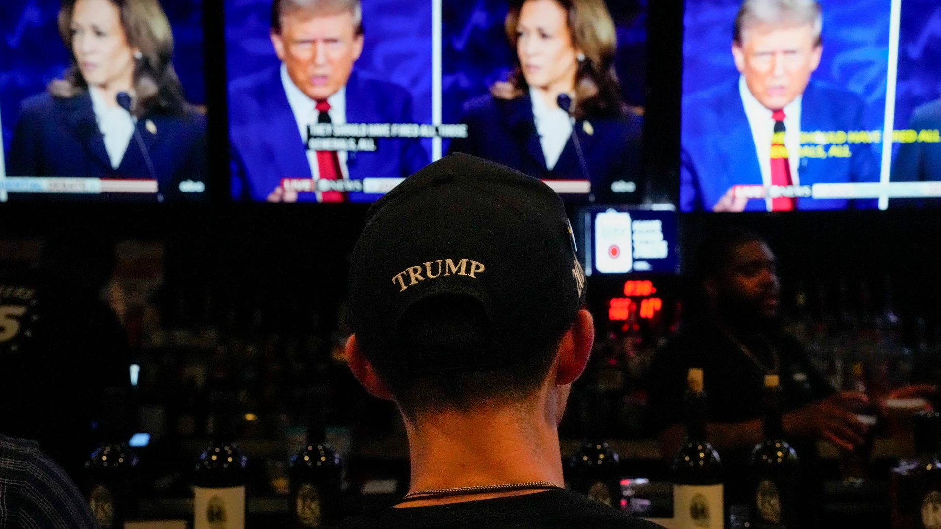 A former President Donald Trump supporter watches during the presidential debate between Republican presidential nominee former President Donald Trump and Democratic presidential nominee Vice President Kamala Harris at Jonathan's Grille, Tuesday, Sept. 10, 2024, in Nashville, Tenn. (AP Photo/George Walker IV)