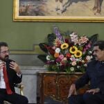Venezuelan President Nicolas Maduro listens to the newly appointed Spanish ambassador to Venezuela Ramon Santos, during the presentation of credentials at the Miraflores presidential palace in Caracas on January 24, 2023. 