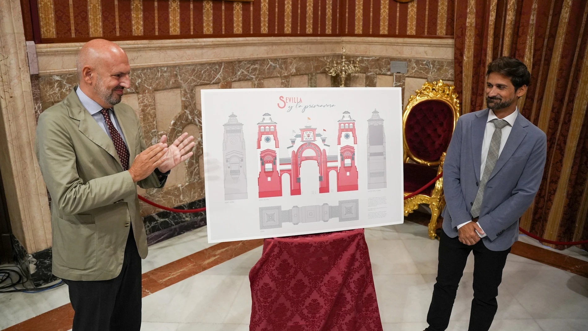El delegado de Fiestas Mayores del Ayuntamiento de Sevilla, Manuel Alés, junto al autor de la portada el arquitecto técnico Pablo Escudero Gispert.REMITIDA / HANDOUT por AYUNTAMIENTO DE SEVILLAFotografía remitida a medios de comunicación exclusivamente para ilustrar la noticia a la que hace referencia la imagen, y citando la procedencia de la imagen en la firma18/09/2024