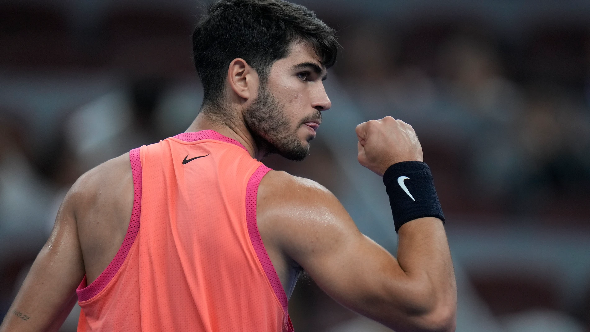 Carlos Alcaraz of Spain reacts as he plays against Tallon Griekspoor of Netherlands during their men's singles match of the China Open tennis tournament, at the National Tennis Center in Beijing, Sunday, Sept. 29, 2024. (AP Photo/Andy Wong)
